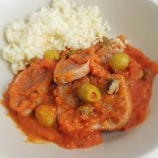 Receta guatemalteca de lengua en salsa 1 Plato de lengua en salsa guatemalteca acompañada con arroz un delicioso platillo de la gastronomía guatemalteca